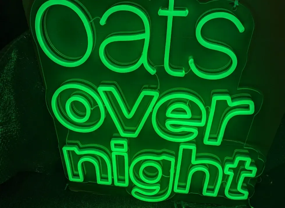 Oats Overnight trade show booth featuring brand colors and dynamic design elements