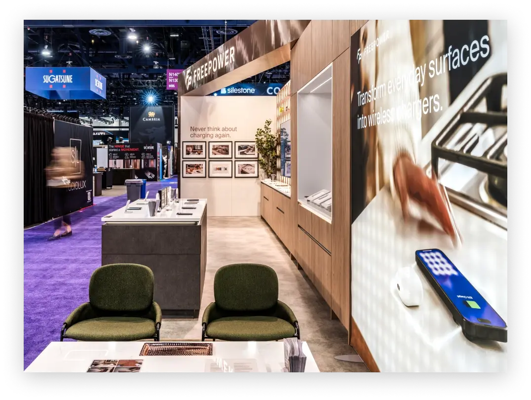 Interior layout of Freepower's trade show booth with modern design elements.