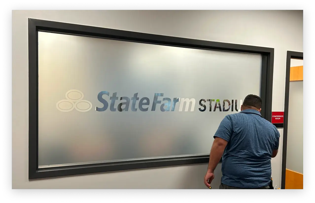 Installation of custom graphics at State Farm Stadium by Highway 85 Creative